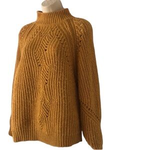 Woman’s warm mustard fall color knit long sleeve sweater